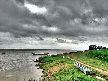 Scenic view of sea against cloudy sky