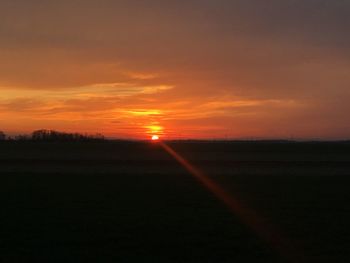 Silhouette landscape against sky during sunset