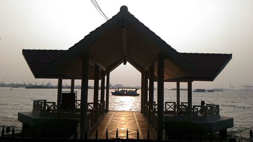 Pier on sea against sky