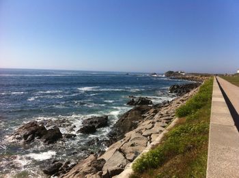 Scenic view of sea against blue sky