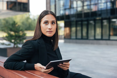 Young woman using mobile phone