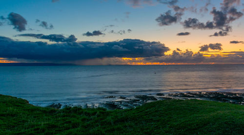 Scenic view of sea against sky during sunset