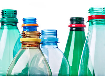 Close-up of glass bottle against white background