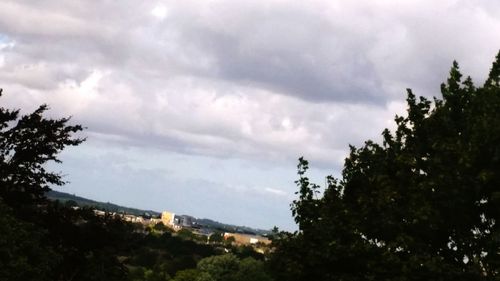 Low angle view of building against cloudy sky