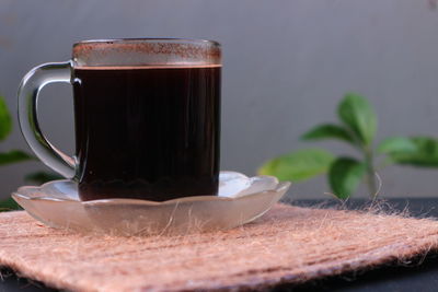Close-up of coffee cup on table