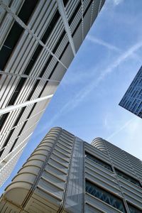 Low angle view of modern buildings against sky