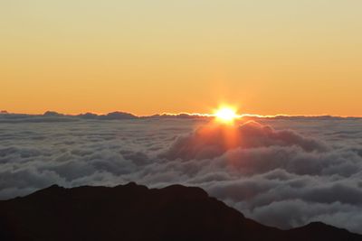 Scenic view of sea against clear sky during sunset