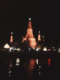 Reflection of illuminated buildings in water