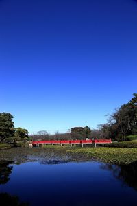 Bridge over river against clear sky
