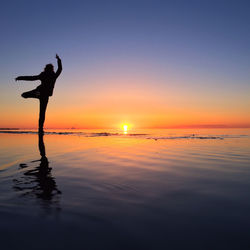 Silhouette of person standing on beach