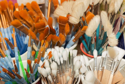 Close-up of paintbrushes displayed for sale