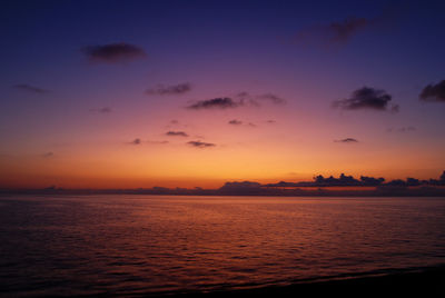 Scenic view of sea against romantic sky at sunset