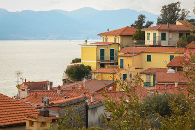 High angle view of townscape by sea