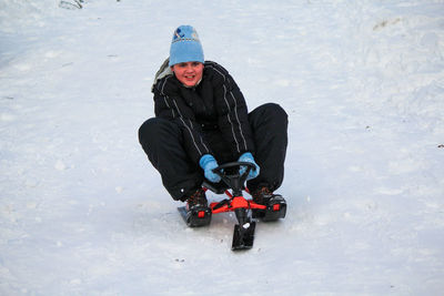 Man sitting in sledge 