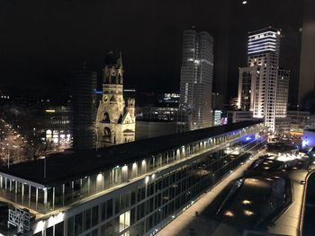 Illuminated buildings in city at night