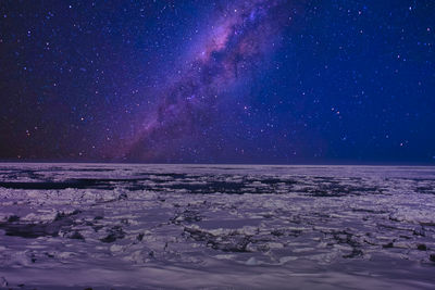 Scenic view of sea against sky at night