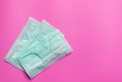 High angle view of ice cream against pink background