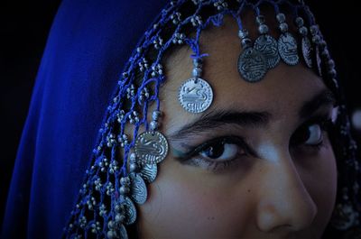 Close-up portrait of teenage girl wearing traditional clothing