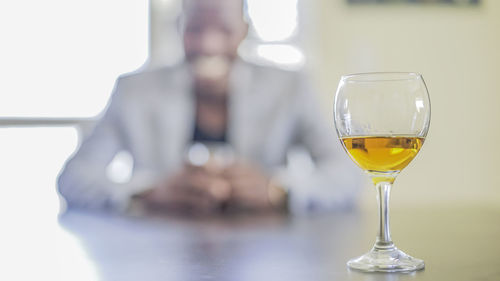 Close-up of wineglass on table