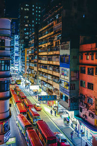 High angle view of city street and buildings at night