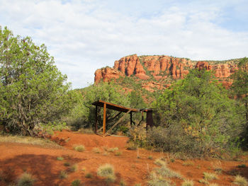 View of rock formations on landscape against sky