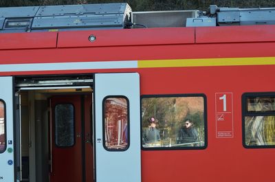 Red train at railroad station