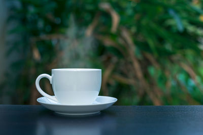 Close-up of coffee cup on table