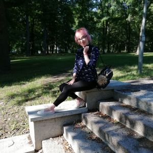 Portrait of woman sitting outdoors