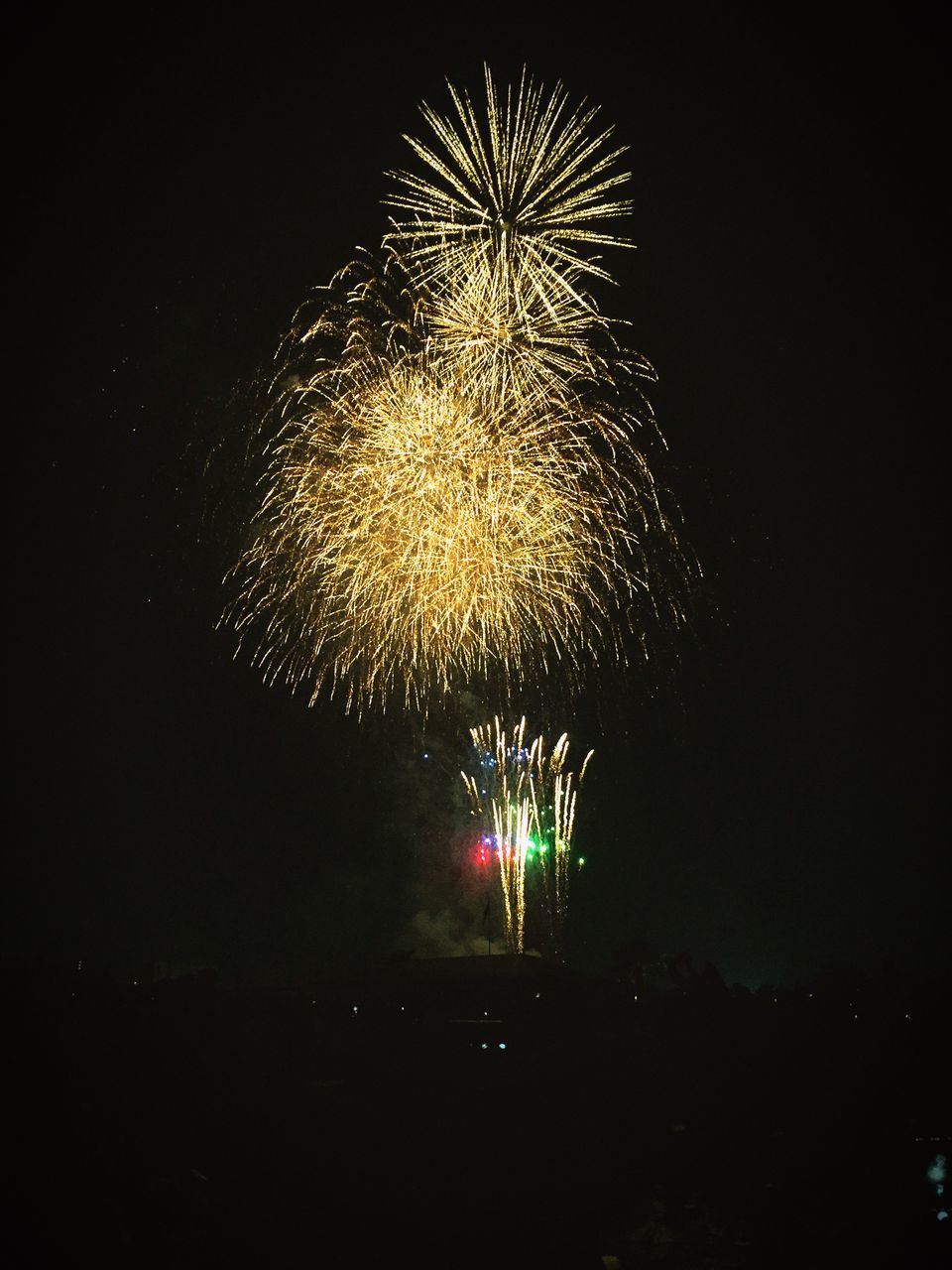 night, illuminated, firework display, exploding, celebration, long exposure, firework - man made object, glowing, motion, sparks, event, firework, arts culture and entertainment, blurred motion, entertainment, low angle view, fire - natural phenomenon, celebration event, sky, multi colored