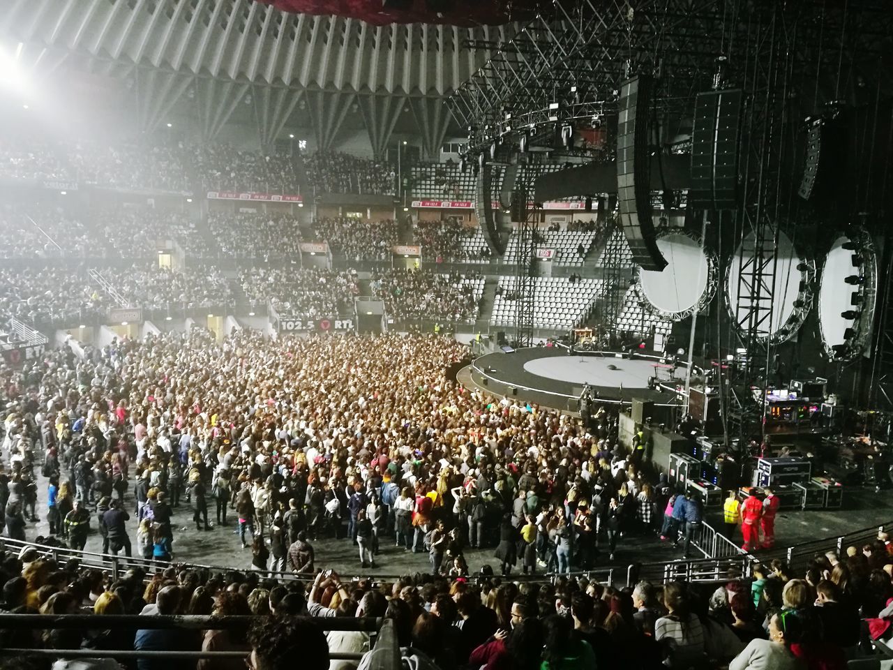 CROWD AT ILLUMINATED STREET