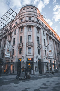 Street by building against sky