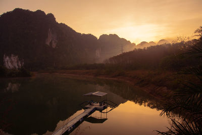 Scenic view of lake against sky during sunset