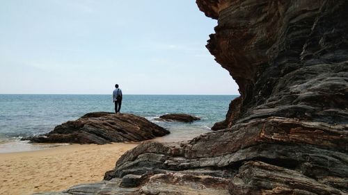 Rear view of woman looking at sea shore