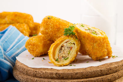 Close-up of fried spring rolls with noodles stuffing