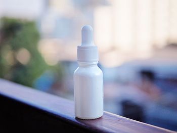 Close-up of glass bottle on table