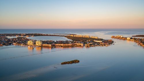 High angle view of sea against sky during sunset