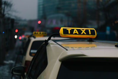 View of taxis on city street