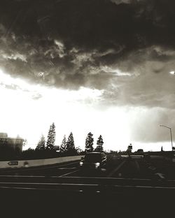 Cars on road against sky