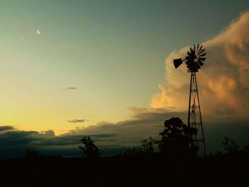 Low angle view of silhouette trees against sky at sunset