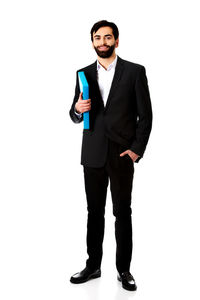 Portrait of young man standing against white background