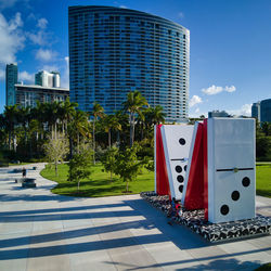 View of modern buildings against blue sky