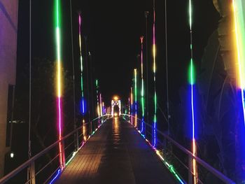 Illuminated bridge at night