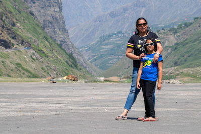 Full length of couple walking on road