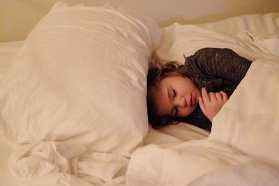 Woman lying on bed