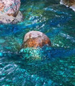 View of sea with rocks in background