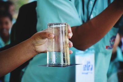 Close-up of hand holding drink