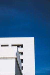 Low angle view of building against blue sky