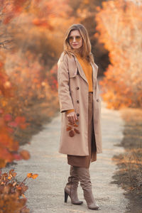 Portrait of woman standing in autumn