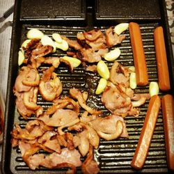 Close-up of meat on barbecue grill