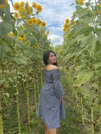 Young woman standing on field